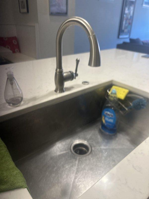 Completed plumbing fixture inspection and assessment for previously sold repair work. Evaluated bathtub drain assembly, overflow plate, and chrome fixtures, confirming proper installation and functionality. Inspected kitchen sink area including pull-down faucet and undermount basin to ensure all components were operating correctly per the original repair scope.