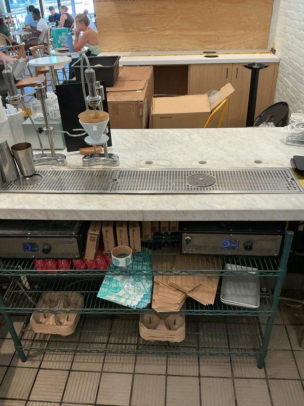 Responded to callback for commercial coffee bar plumbing system. Inspected and documented undercounter plumbing connections, drainage systems, and sink installation at beverage service station. Verified proper operation of drip tray drainage, assessed water supply lines to coffee equipment, and confirmed all plumbing fixtures were functioning correctly with no leaks or drainage issues present.
