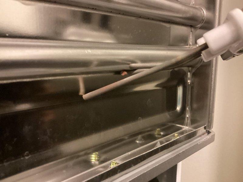 Completed annual maintenance service on tankless water heater system, performing comprehensive flush procedure to remove mineral deposits and sediment buildup from heat exchanger coils. Inspected and cleaned inlet filter screen, which showed accumulated debris, and verified all internal components for proper operation and efficiency.