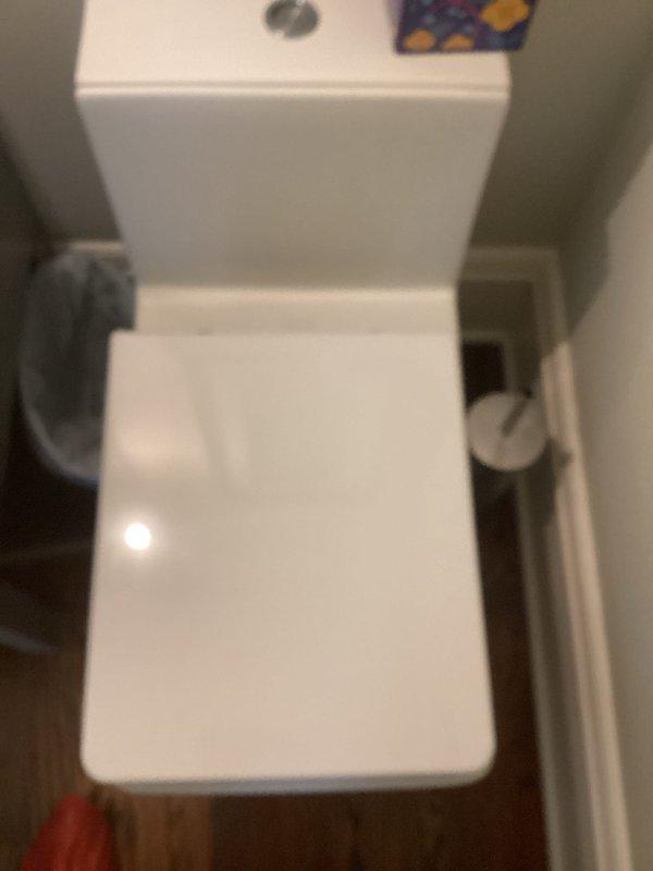 Completed toilet replacement service following previous unsuccessful installation attempt where fixture dimensions were incompatible with existing rough-in configuration. Installed new Kohler two-piece toilet with proper fit specifications for the bathroom space. Addressed additional plumbing concerns including kitchen faucet head replacement and resealing of sink perimeter to prevent water intrusion and potential cabinet damage. Verified all fixtures for proper operation, adequate water flow, and leak-free connections upon completion.