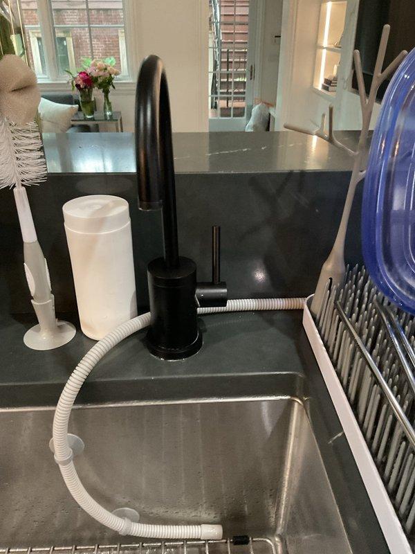 Installed new black pull-down kitchen faucet with undermount stainless steel sink in upstairs kitchen, including connection of water supply lines and testing for proper operation. Inspected and repaired leaking exterior spigot at rear of home, addressing water seepage issue and ensuring proper functionality of outdoor water supply.