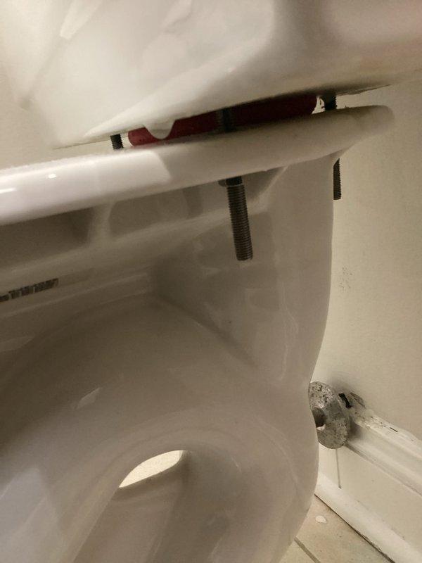 Responded to toilet leaking from the bottom. Upon inspection, removed tank lid and assessed internal flush mechanism components including fill valve assembly and flush valve. Identified source of leak at base of toilet where fixture meets floor. Inspected tank-to-bowl mounting hardware and wax ring seal integrity. Completed necessary repairs to resolve leak issue and restore proper toilet function.