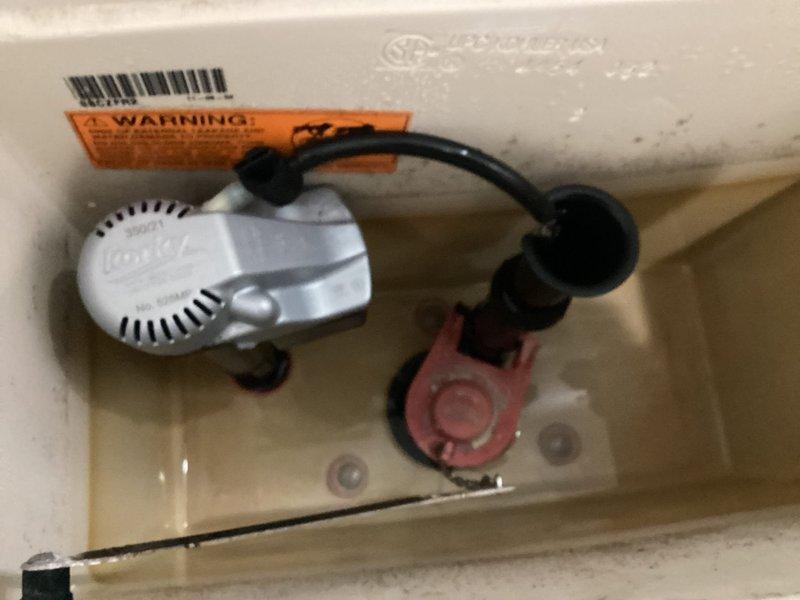 Responded to toilet leaking from the bottom. Upon inspection, removed tank lid and assessed internal flush mechanism components including fill valve assembly and flush valve. Identified source of leak at base of toilet where fixture meets floor. Inspected tank-to-bowl mounting hardware and wax ring seal integrity. Completed necessary repairs to resolve leak issue and restore proper toilet function.