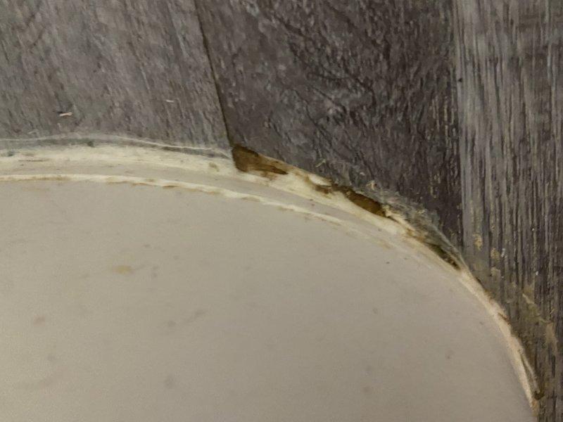 Responded to warranty callback for toilet leaking waste water at base. Performed complete pull and reset of toilet fixture. Removed toilet from flange, inspected and replaced defective wax ring that was causing improper seal. Cleaned flange surface, installed new wax ring, repositioned and secured toilet to floor with proper compression. Tested fixture with multiple flushes to verify complete seal with no leakage present.