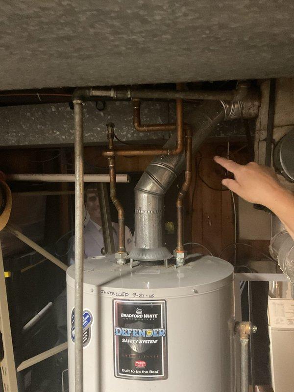Performed on-site assessment of existing Bradford White water heater installed in 2016 to provide estimate for replacement unit or piping modifications. Inspected current copper piping configuration, connections at tank top, and pressure relief valve system to determine scope of work needed for new installation or repairs.