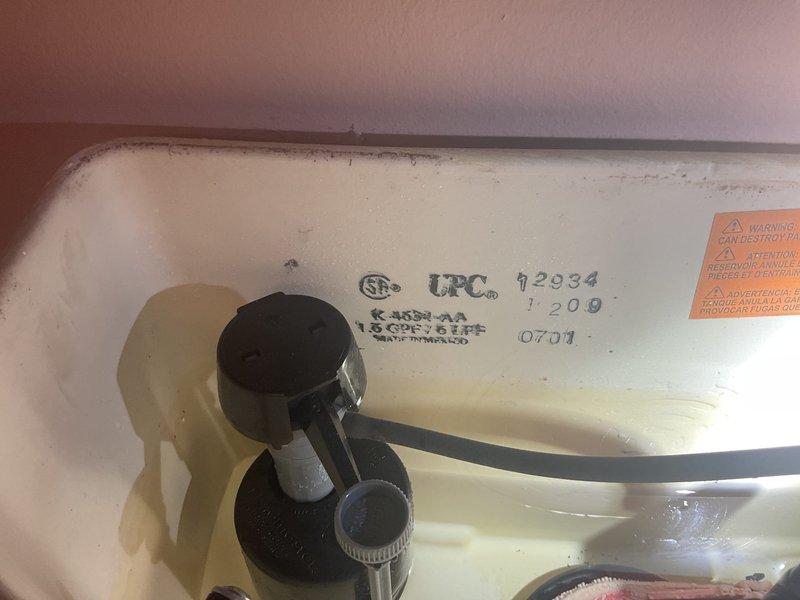 Responded to service call for leaking toilet. Upon inspection, identified issue with flush valve assembly and flapper mechanism in Kohler toilet tank. Tank interior showed significant mineral buildup and discoloration indicating age-related wear. Inspected fill valve, float assembly, and flush chain connections for proper operation. Documented existing condition of tank components including CSA and UPC certified flush valve system. Assessed tank integrity and identified source of water leak from compromised flapper seal, allowing water to continuously seep into bowl. Photographed internal tank components and manufacturer specifications for service records.