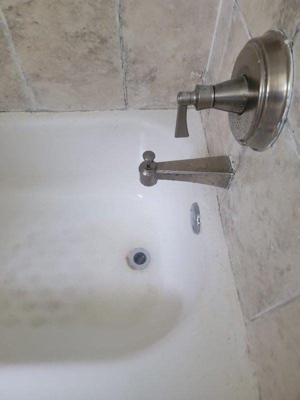 Responded to a clogged drain service call and successfully cleared a bathtub drain obstruction using a flexible drain auger. Extracted a significant accumulation of hair and organic debris that was blocking the drain line, restoring proper drainage function to the fixture.