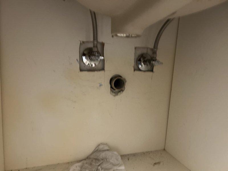 Responded to building shutdown for plumbing repair beneath bathroom vanity. Serviced under-sink plumbing connections including chrome water supply shut-off valves and flexible supply lines. Addressed drain pipe opening and completed repairs to restore full functionality, allowing building operations to resume.