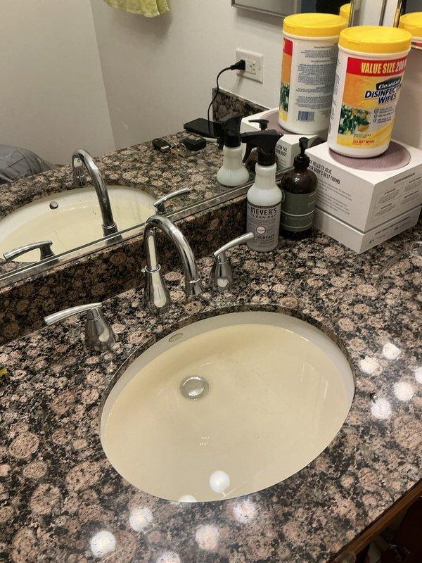 Responded to building shutdown for plumbing repair beneath bathroom vanity. Serviced under-sink plumbing connections including chrome water supply shut-off valves and flexible supply lines. Addressed drain pipe opening and completed repairs to restore full functionality, allowing building operations to resume.
