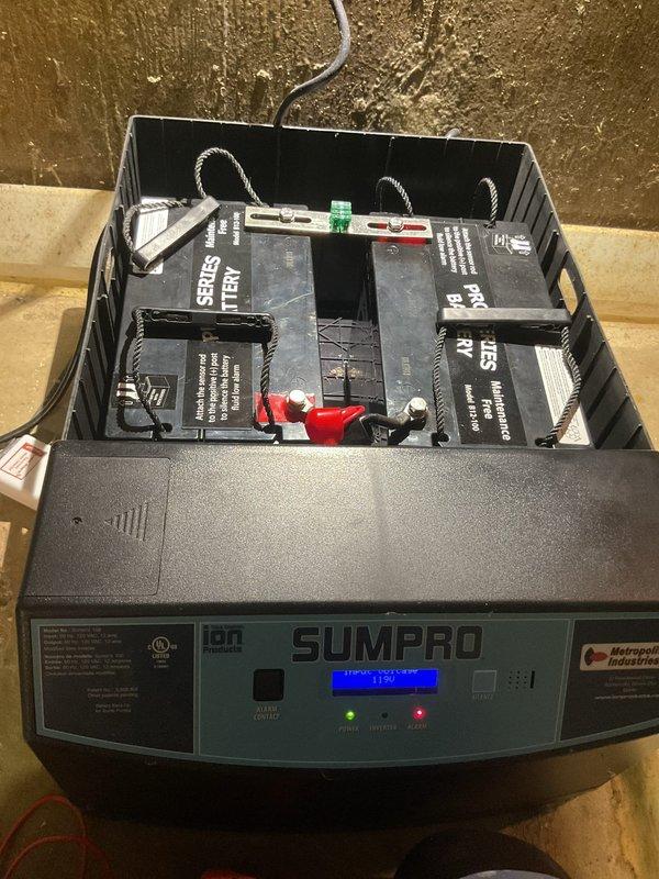 Performed warranty service on SumPro battery backup sump pump system. Replaced failed batteries in the backup unit with new sealed lead-acid batteries, reconnected terminals with proper polarity, tested system functionality, and verified LCD display and indicator lights were operating correctly.