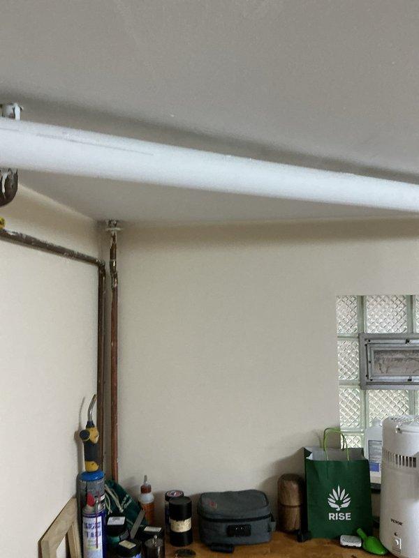 Responded to no-flow condition at exterior spigot. Accessed interior wall cavity to inspect supply plumbing and identified obstruction in water line feeding outdoor fixture. Cleared blockage, tested valve operation, and restored full water flow to exterior spigot. Verified system functionality and secured access panel upon completion.