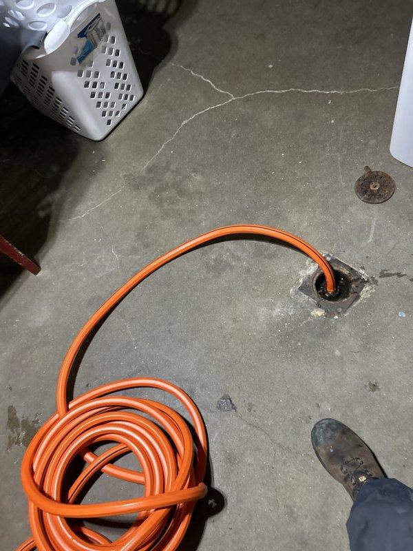 Responded to service call for leaking kitchen sink sprayer on second floor of century-old home where leak had been ongoing for two weeks. Inspected kitchen sink assembly, identified faulty sprayer head and hose connection causing water intrusion. Replaced defective sprayer unit and verified all connections for proper seal. Additionally performed requested maintenance inspection on hot water tank system located in basement utility area, checking temperature and pressure relief valve operation, examining anode rod condition, flushing sediment from tank, and inspecting all water and gas connections for safety and proper function. All systems tested and confirmed operational upon completion.