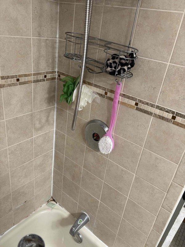 Completed plumbing maintenance service addressing multiple fixture issues in residential bathrooms. Tightened loose shower head connection and secured upstairs bathroom faucet handle to eliminate wobbling and ensure proper operation. Replaced worn shower valve handle with new chrome fixture to restore full control functionality. All fixtures tested for proper water flow, temperature control, and leak-free operation upon completion.