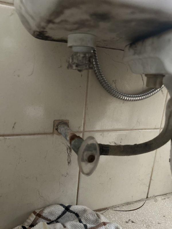 Responded to priority service call for broken toilet supply line. Upon inspection, found deteriorated flexible water supply hose connected to the fill valve with visible corrosion on wall-mounted shut-off valve and mounting hardware. Removed damaged supply line and replaced with new braided stainless steel flex hose, ensuring proper connection to both the fill valve and supply valve. Verified all connections were secure, tested for leaks, and confirmed proper tank fill operation and flush cycle functionality.