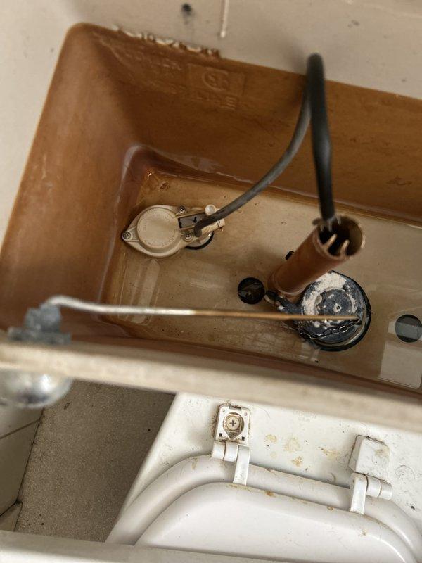 Responded to priority service call for broken toilet supply line. Upon inspection, found deteriorated flexible water supply hose connected to the fill valve with visible corrosion on wall-mounted shut-off valve and mounting hardware. Removed damaged supply line and replaced with new braided stainless steel flex hose, ensuring proper connection to both the fill valve and supply valve. Verified all connections were secure, tested for leaks, and confirmed proper tank fill operation and flush cycle functionality.
