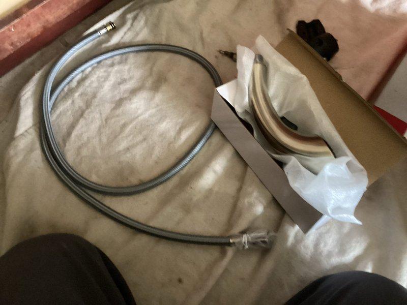 Responded to service call for leaking Wolverine Brass Finale pull-out kitchen faucet previously installed in June 2021. Diagnosed leak originating from supply line connection at the ballcock assembly beneath sink. Replaced deteriorated supply hoses and tightened compression fittings to eliminate dripping condition, tested system under full water pressure to confirm repair integrity.