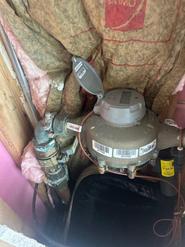 Conducted comprehensive site assessment and plumbing estimate for three-unit apartment building requiring complete plumbing installation. Reviewed existing infrastructure including exposed mechanical utility spaces with aging copper piping showing oxidation, pump/motor units with digital controls, and corroded brass fittings indicating moisture exposure. Evaluated construction progress across multiple units featuring newly installed drywall, exposed framing, concrete subfloors, and roughed-in electrical boxes. Documented all mechanical components, pipe routing requirements, and existing conditions through photographic evidence to prepare accurate scope of work for full plumbing system installation and subsequent inspection upon receipt of plumbing drawings.