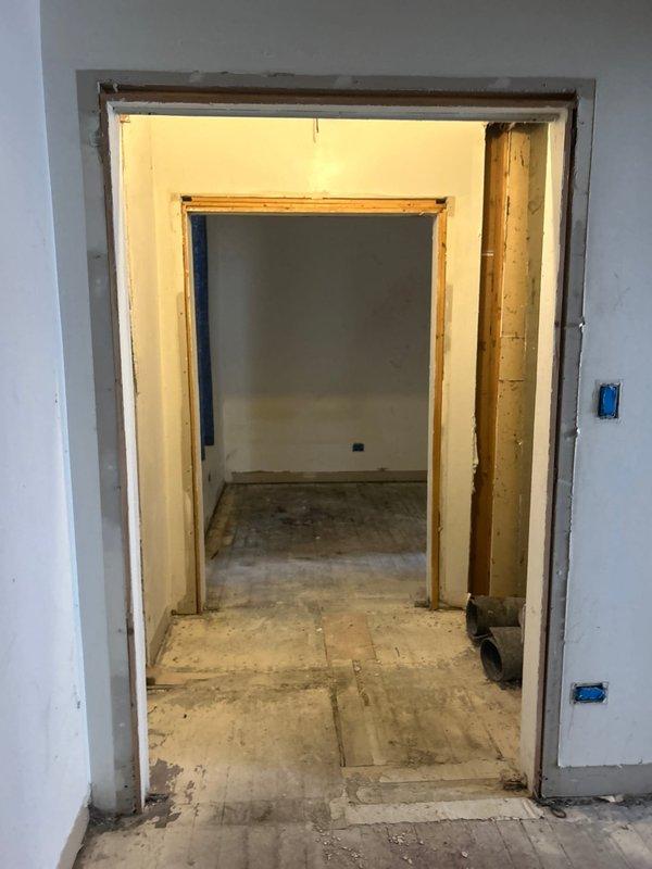 Conducted comprehensive site assessment and plumbing estimate for three-unit apartment building requiring complete plumbing installation. Reviewed existing infrastructure including exposed mechanical utility spaces with aging copper piping showing oxidation, pump/motor units with digital controls, and corroded brass fittings indicating moisture exposure. Evaluated construction progress across multiple units featuring newly installed drywall, exposed framing, concrete subfloors, and roughed-in electrical boxes. Documented all mechanical components, pipe routing requirements, and existing conditions through photographic evidence to prepare accurate scope of work for full plumbing system installation and subsequent inspection upon receipt of plumbing drawings.