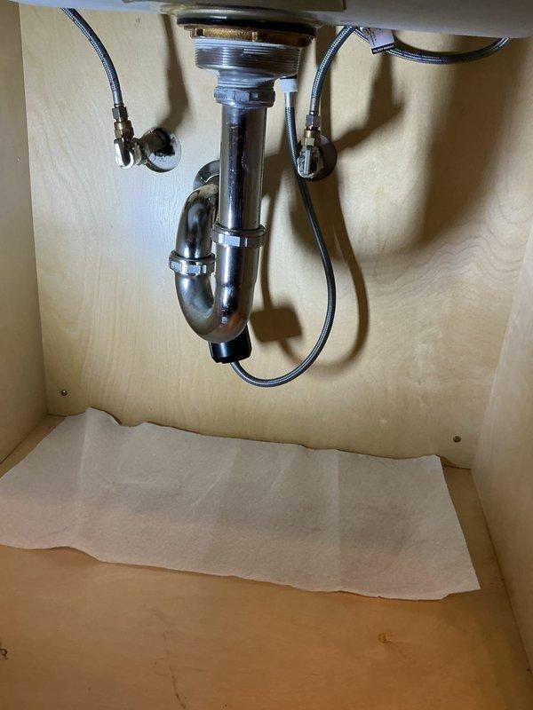 Responded to service call for malfunctioning kitchen faucet in 50-year-old condominium unit. Upon inspection, assessed existing faucet assembly and plumbing connections under sink, which showed signs of age-related wear. Customer had previously attempted DIY repair without resolution and had purchased replacement faucet in preparation for service visit. Removed old faucet fixture and installed customer-supplied replacement unit, connecting new braided supply lines to existing shut-off valves and ensuring proper P-trap alignment. Tested water flow and checked all connections for leaks, confirmed proper operation of new faucet assembly, and restored full functionality to kitchen sink.