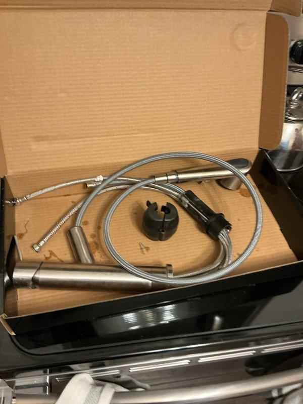 Responded to service call for malfunctioning kitchen faucet in 50-year-old condominium unit. Upon inspection, assessed existing faucet assembly and plumbing connections under sink, which showed signs of age-related wear. Customer had previously attempted DIY repair without resolution and had purchased replacement faucet in preparation for service visit. Removed old faucet fixture and installed customer-supplied replacement unit, connecting new braided supply lines to existing shut-off valves and ensuring proper P-trap alignment. Tested water flow and checked all connections for leaks, confirmed proper operation of new faucet assembly, and restored full functionality to kitchen sink.