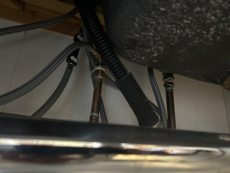 Installed customer-supplied kitchen faucet, including connection of hot and cold water supply lines with braided stainless steel hoses and proper mounting of all hardware beneath the sink. Verified all connections for leaks and confirmed proper operation of the new faucet upon completion.