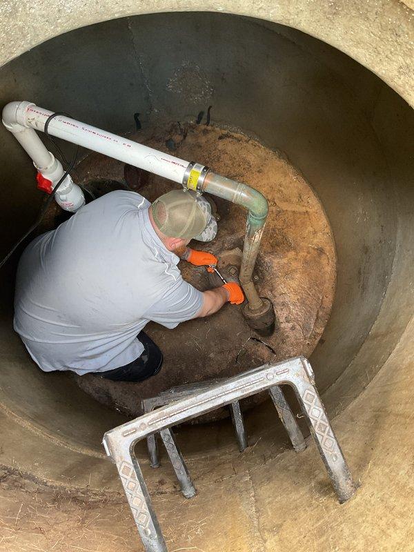 Performed annual routine maintenance on front yard check valve system in concrete pump pit. Accessed pit via ladder, inspected check valve assembly, PVC and metal pipe connections for proper operation and structural integrity. Cleaned accumulated sediment and debris from pit floor and around valve components. Verified check valve functionality and confirmed all plumbing connections were secure with no leaks detected. System operating within normal parameters upon completion of maintenance service.