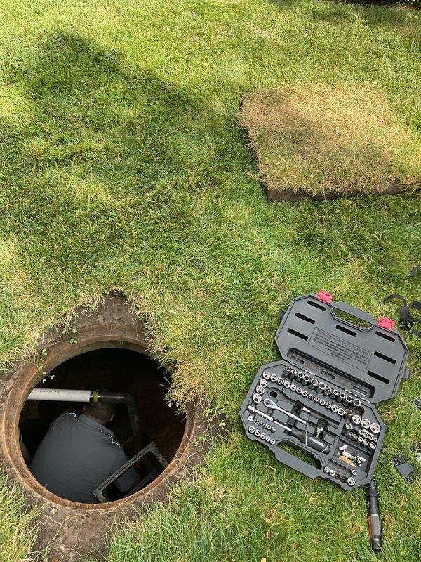 Performed annual routine maintenance on front yard check valve system in concrete pump pit. Accessed pit via ladder, inspected check valve assembly, PVC and metal pipe connections for proper operation and structural integrity. Cleaned accumulated sediment and debris from pit floor and around valve components. Verified check valve functionality and confirmed all plumbing connections were secure with no leaks detected. System operating within normal parameters upon completion of maintenance service.