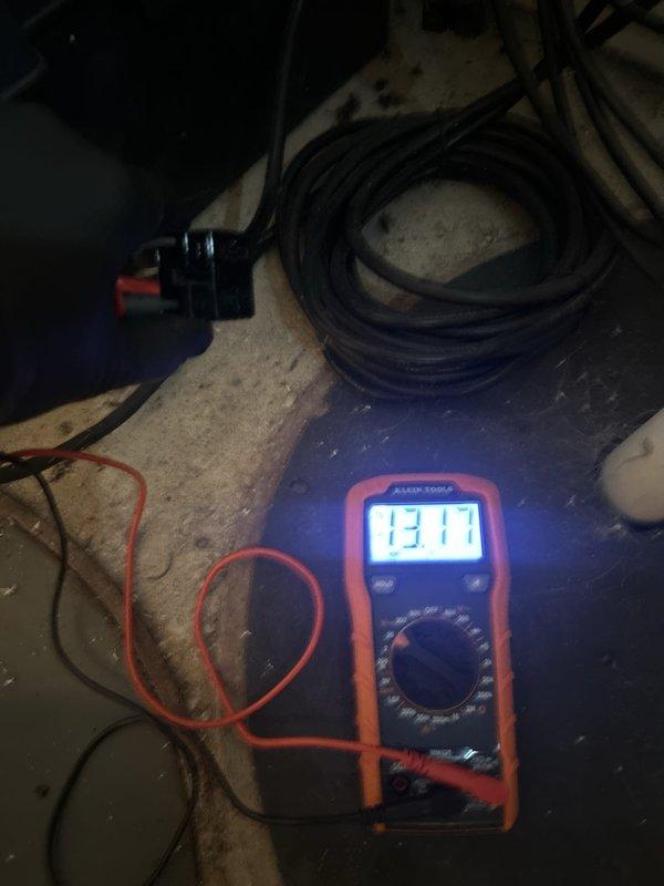 Completed sump pump installation at residential property. Verified electrical connections and tested system functionality using digital multimeter, confirming proper voltage readings of 13.11V at connection points. Installed new sump pump unit with all necessary components, ensured proper drainage configuration, and conducted operational testing to verify automatic float switch activation and pump cycling. System is fully operational and ready for service.