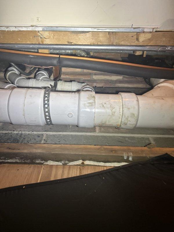 Installed new shutoff valve behind refrigerator to provide water supply isolation capability where no existing shutoff was previously present. Accessed plumbing lines in crawl space beneath kitchen area, identified appropriate water supply line, and completed valve installation per standard plumbing code requirements. Verified proper operation of shutoff valve and confirmed no leaks at connection points upon completion.