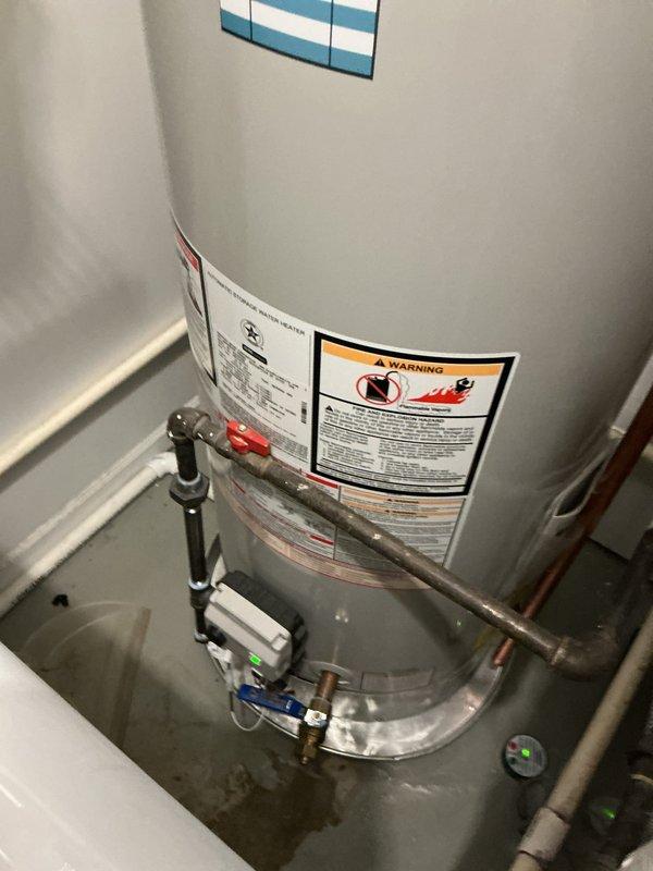 Completed comprehensive annual plumbing maintenance inspection of residential property. Performed thorough examination of water heater system, noting active moisture accumulation at base of unit and assessing condition of copper supply lines, pressure relief valve, and connection points. Inspected ductwork system, documenting advanced corrosion on metal piping with significant rust deterioration and interior sediment buildup requiring future attention.