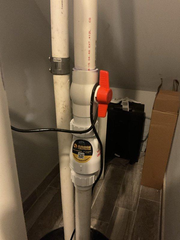 Responded to emergency ejector pump failure in basement of 10-year-old home. Removed failed ejector pump system and installed new replacement unit with complete PVC discharge piping assembly, ball valve shutoff, check valve, and electrical control components. System tested and verified operational with proper float switch function and discharge flow.