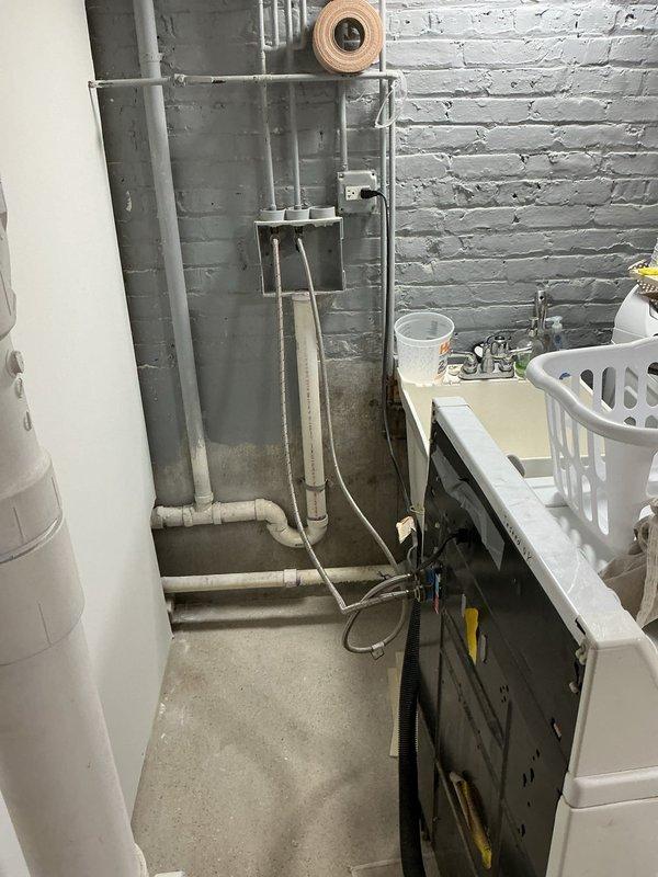Responded to customer complaint of sewage odor in bathrooms. Previous technician had ruled out toilet as source and confirmed proper wax ring seal. Inspected basement plumbing infrastructure and drainage system to identify odor source. Confirmed shower drain lacks proper P-trap installation, allowing sewer gases to enter living space through drain line. Documented existing PVC drainage configuration and photographed plumbing layout for reference. Reviewed multiple remediation options with customer including P-trap installation methods, venting requirements, and code compliance considerations to permanently eliminate odor issue.