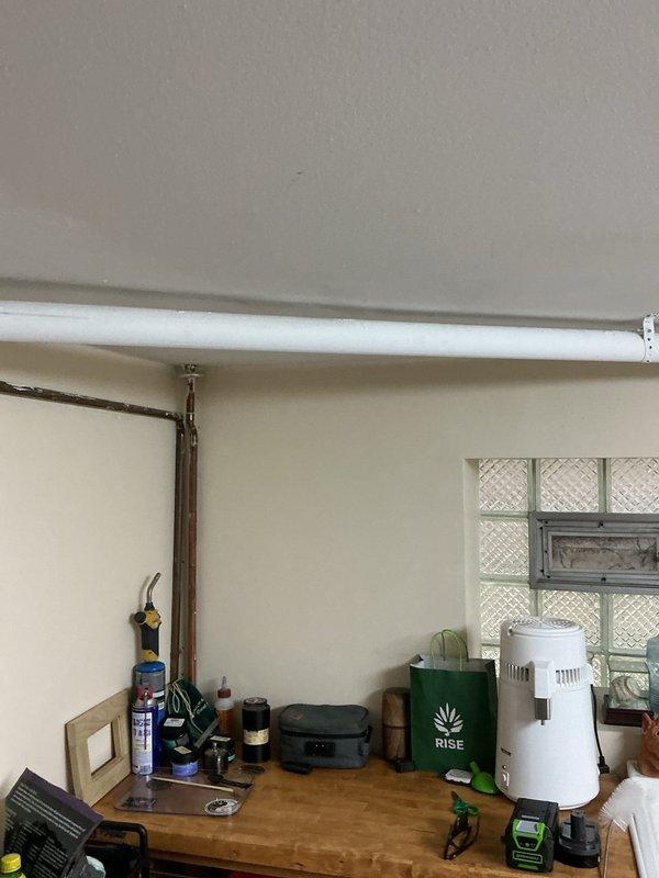 Installed two blue ball valves with copper and flexible piping connections in basement crawl space area. Standard stock plumbing components were secured to existing wooden structural supports, with all fittings and connectors properly assembled to ensure reliable water flow control and system integrity.