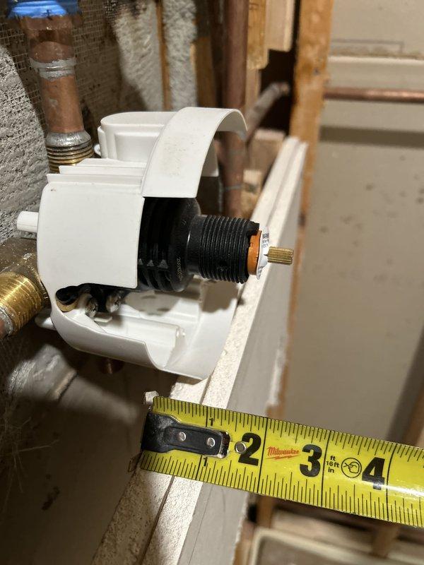 Completed piping installation work involving securing and stabilizing plumbing lines. Strapped and tightened copper pipes with brass fittings to ensure proper support and eliminate movement. Installed white plastic plumbing fixture with valve assembly on baseboard area, including brass-colored adjustment valve with threaded components. Performed comprehensive pressure testing of all connections to verify system integrity and identify any potential leaks. All piping secured to code specifications with appropriate strapping, and pressure test confirmed system is operating within normal parameters with no leaks detected.