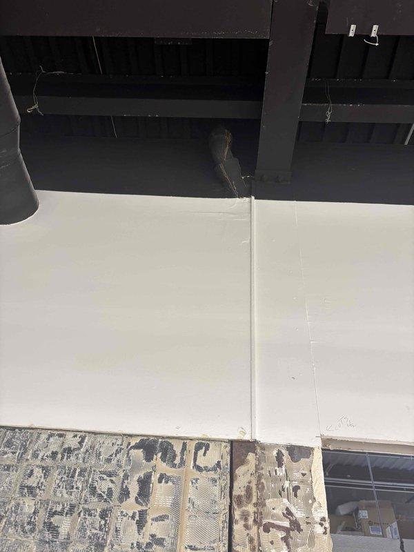 Performed video camera inspection of plumbing system using specialized optical inspection equipment. Documentation captured structural conditions of rooftop plumbing access points, including weathered wooden support elements and membrane roofing surfaces where plumbing penetrations are located. Inspection equipment functioning properly with LED illumination ring operational for clear visibility within pipe systems.
