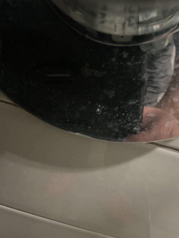 Performed routine maintenance service on tankless water heater system, including complete flush procedure to remove mineral deposits and sediment buildup. Inspected unit components and documented significant accumulation of debris on internal parts, which was cleaned during the service to restore optimal performance and efficiency.