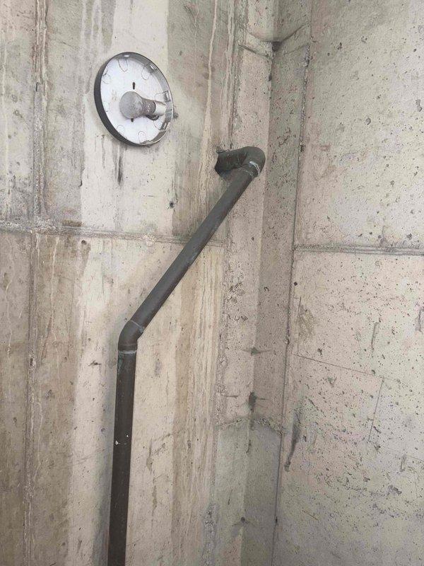 Conducted comprehensive site assessment of commercial sump pump system requiring replacement of both primary and secondary pumping mechanisms within existing basin. Evaluated current installation including discharge piping, electrical connections, and basin configuration in basement utility area with concrete block construction. Documented existing conditions through photographic survey showing vertical discharge pipe routing, utility panel locations, and overhead infrastructure to develop accurate replacement estimate for dual pump system upgrade.