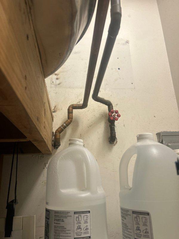 Performed comprehensive onsite inspection of existing 50-gallon Bradford White lowboy electric water heater installation at residential condo unit. Evaluated current plumbing connections, electrical supply, copper piping configuration, shut-off valve accessibility, and clearance requirements for replacement with new 47-gallon lowboy electric water heater model. Documented equipment specifications, mounting location, and existing infrastructure to provide accurate replacement estimate.