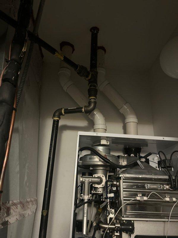 Completed diagnostic evaluation of 10-year-old Navien tankless water heater that experienced operational failure. Performed comprehensive visual inspection of unit's internal components, heat exchanger, piping connections, and venting system. Documented current condition of equipment and all associated plumbing infrastructure to provide estimate for repair or replacement options.