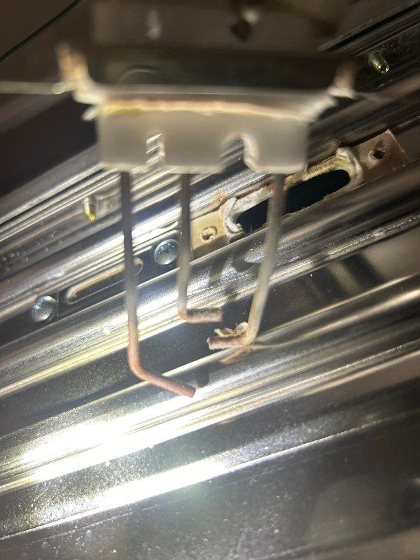 Performed annual maintenance service on tankless water heater system, completing a comprehensive flush procedure to remove mineral buildup and scale deposits from the heat exchanger assembly. Inspected internal components including the copper heat exchanger coils, mounting brackets, and finned surfaces, documenting the condition with photographs showing normal wear patterns and minor accumulation of debris between the metallic fins.