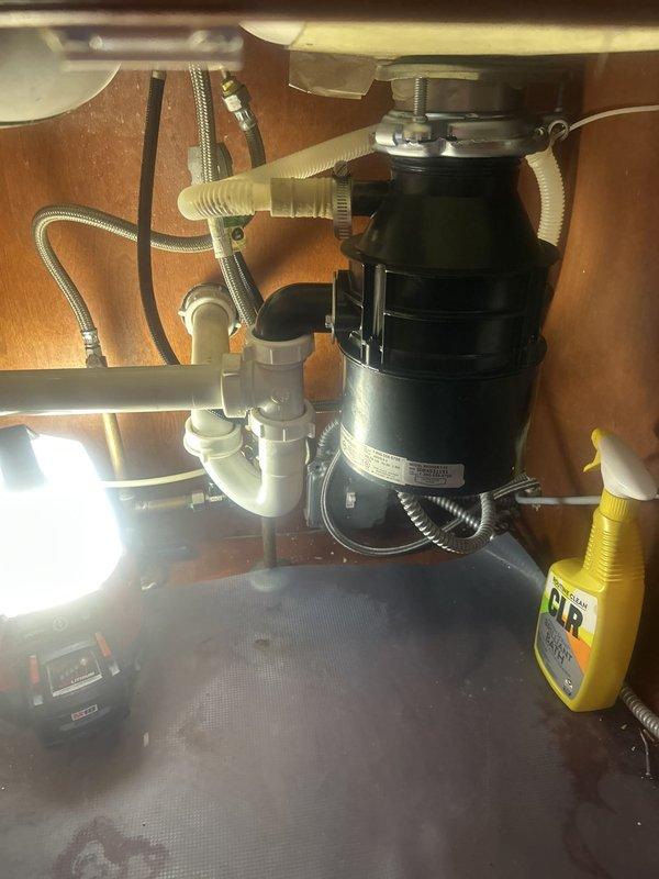 Replaced a 14-year-old worn-out garbage disposal unit with a new disposal system, including removal of the existing unit, installation of new mounting assembly and drain connections, and verification of proper operation. Additionally, performed repairs to the kitchen faucet to restore full functionality.