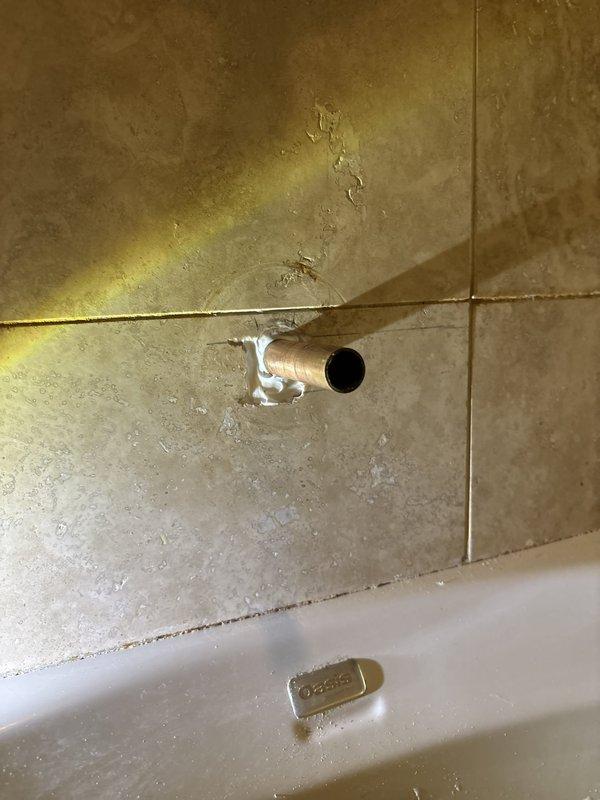 Installed electrical toilet seat per customer request. Addressed bathtub drain stopper malfunction by inspecting the drain assembly and overflow mechanism. Identified worn linkage components preventing proper seal closure. Examined exposed copper piping at tub wall penetration showing signs of age and deteriorated caulking that required attention for proper moisture barrier integrity.