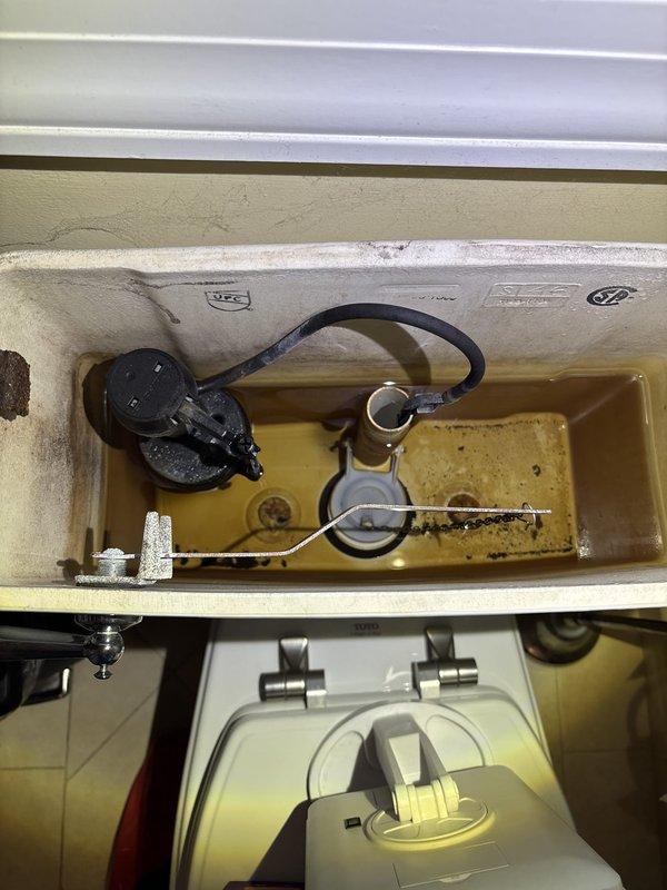 Responded to priority VIP maintenance call for multiple plumbing concerns. Inspected and tested sump/ejector pump for proper operation and verified functionality. Evaluated gas water heater for safety and performance standards. Addressed primary bathroom shower temperature control issue by diagnosing Moen cartridge malfunction causing excessively hot water delivery. Investigated non-operational garbage disposal unit that failed to spin despite reset button activation, determining unit required replacement due to motor failure. Documented existing conditions including toilet tank mineral buildup and discoloration for maintenance records.