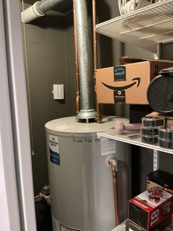 Completed scheduled water heater flush on first floor unit in 30-year-old residence. Drained and flushed tank to remove sediment buildup, inspected all connections and valves, and verified proper operation of venting system. Additionally inspected toilet tank components during visit, noting mineral deposits and water staining consistent with age of home; all plumbing fixtures found operational with no immediate concerns reported by homeowner.