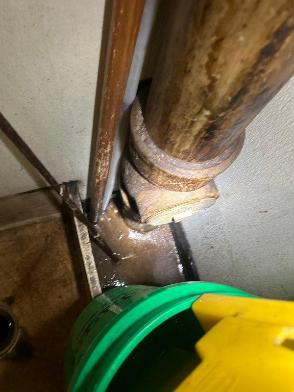 Completed plumbing service repair on commercial restroom toilet fixture. Inspected and serviced wall-mounted chrome flush valve assembly with manual handle operation. Verified proper function of flush mechanism and water flow control. Documented existing conditions of porcelain fixture, wall-mounted valve components, and surrounding tile work for service records.