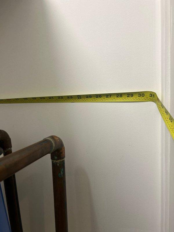 Conducted on-site assessment for water filtration system installation. Measured existing plumbing configuration including aged copper piping with visible oxidation and evaluated available cabinet space dimensions to determine proper filter placement and clearance requirements. Documented measurements and existing conditions to prepare comprehensive estimate for new water filter installation.