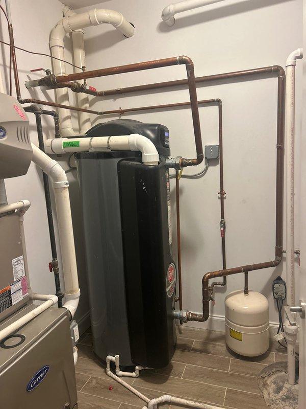 Responded to ignition failure on commercial Rheem tanked water heater. Diagnosed ignition system malfunction, documented equipment configuration and plumbing connections, and provided repair estimate for customer approval.