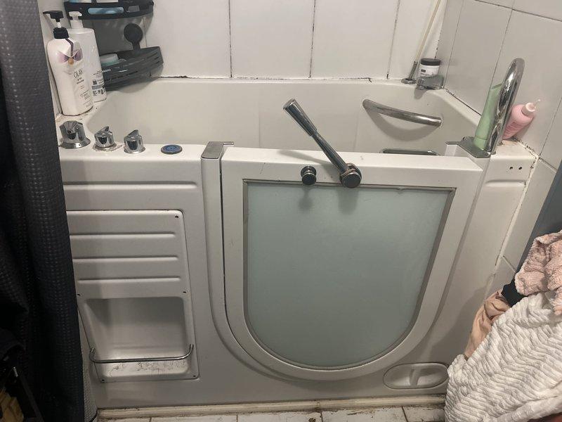 Responded to service call for walk-in bathtub with malfunctioning shower trap assembly. Inspected the trap mechanism and confirmed failure requiring replacement. Examined the jetted tub system and associated plumbing fixtures to ensure proper operation and identify any additional concerns. Completed necessary repairs to restore full functionality of the bathing system.