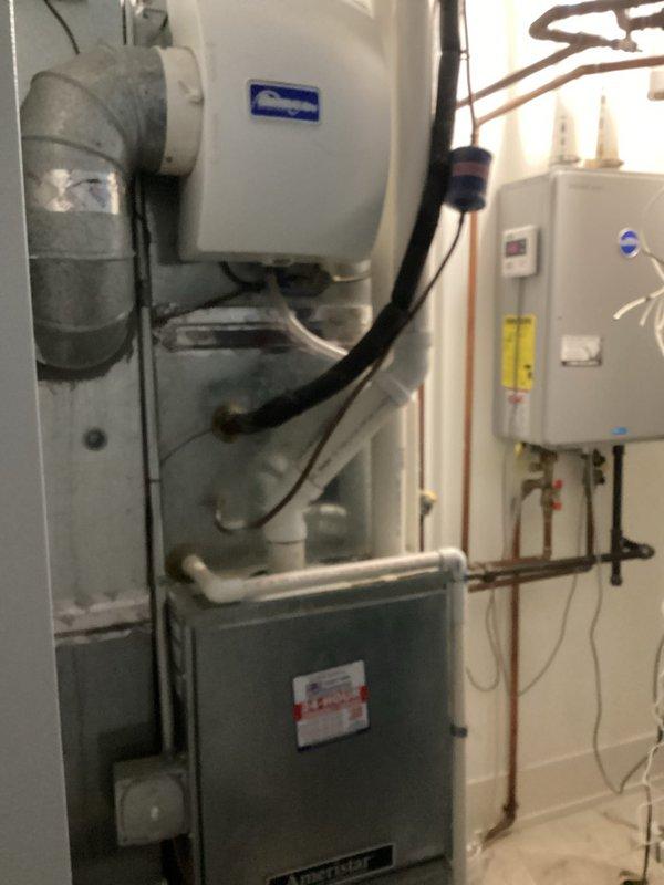 Performed comprehensive annual maintenance service on a 7-year-old Rheem tankless water heater that was displaying error code 10, indicating exhaust system issues. Completed full descaling flush of the heat exchanger using appropriate cleaning solution to remove mineral buildup and restore optimal heat transfer efficiency. Inspected and cleared the exhaust vent system to eliminate blockages and particulate accumulation that triggered the fault code. Verified all copper supply and return lines, checked shut-off valves for proper operation, and confirmed PVC condensate drain lines were flowing freely. Tested unit operation post-service, confirmed error code cleared, and verified proper combustion and venting performance. System restored to full operational status with improved efficiency.
