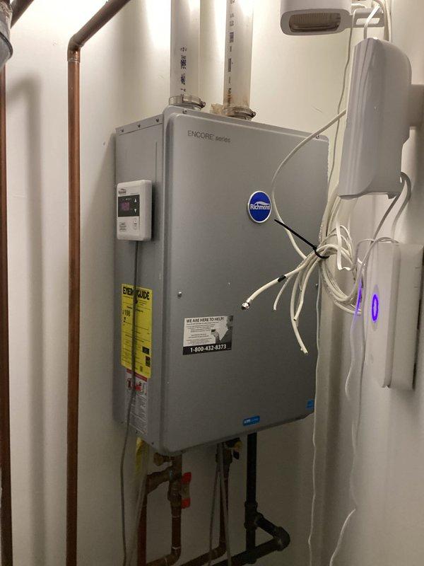 Performed comprehensive annual maintenance service on a 7-year-old Rheem tankless water heater that was displaying error code 10, indicating exhaust system issues. Completed full descaling flush of the heat exchanger using appropriate cleaning solution to remove mineral buildup and restore optimal heat transfer efficiency. Inspected and cleared the exhaust vent system to eliminate blockages and particulate accumulation that triggered the fault code. Verified all copper supply and return lines, checked shut-off valves for proper operation, and confirmed PVC condensate drain lines were flowing freely. Tested unit operation post-service, confirmed error code cleared, and verified proper combustion and venting performance. System restored to full operational status with improved efficiency.